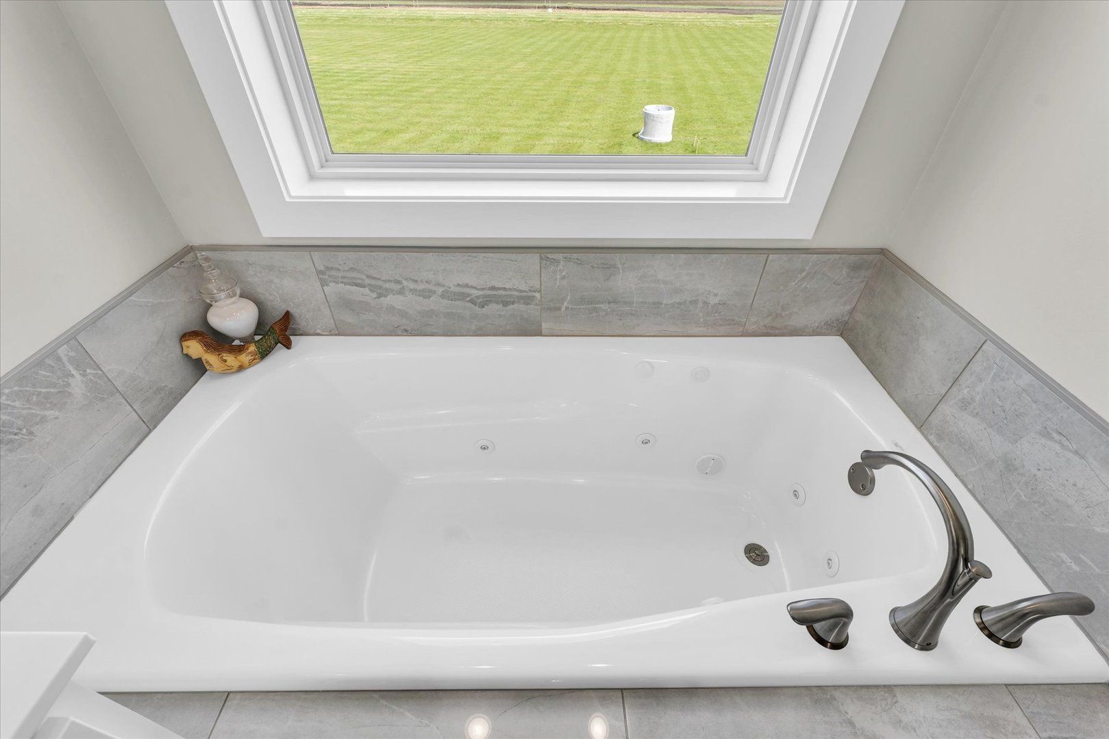 1908 Littlefield Lane Mahomet, IL 61853 - Photo 32 of 51 a bathroom with a tub and a window