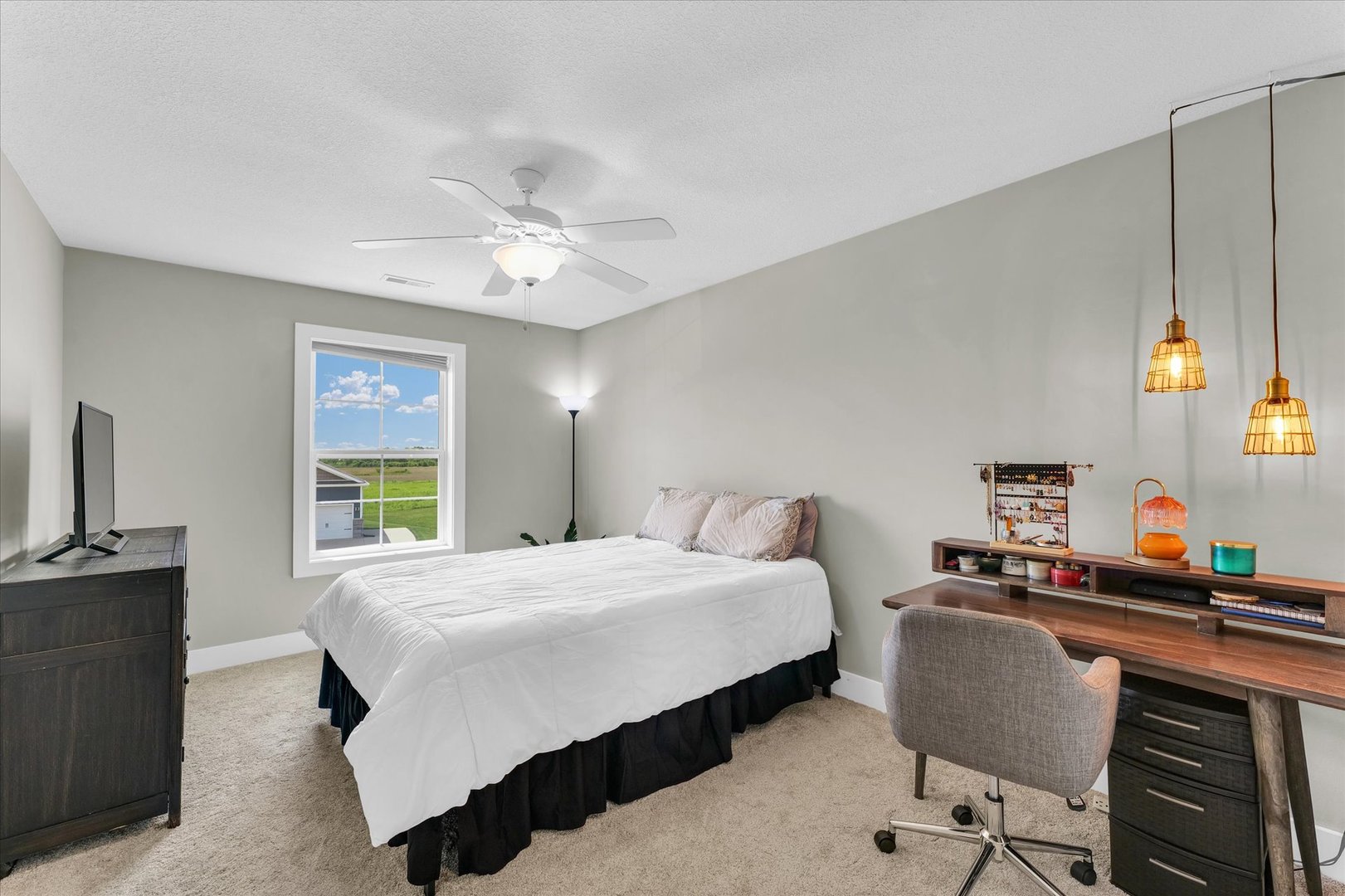 1908 Littlefield Lane Mahomet, IL 61853 - Photo 35 of 51 a bedroom with a bed and a chandelier