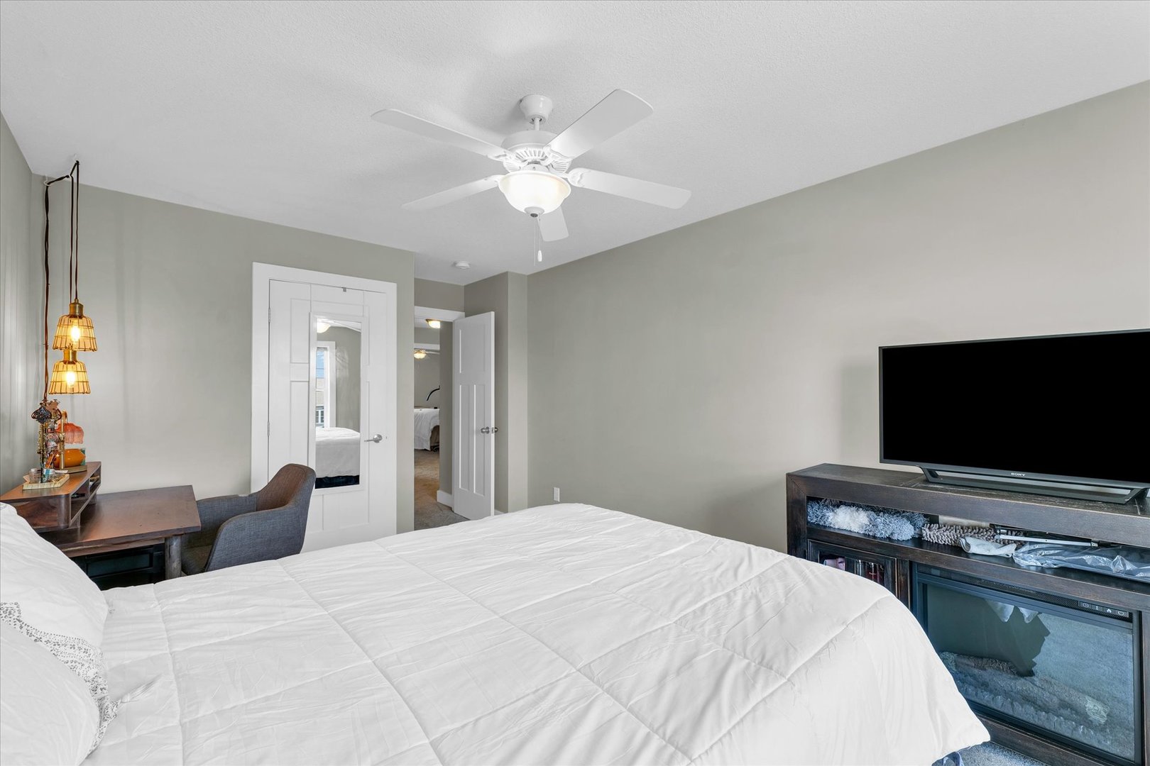 1908 Littlefield Lane Mahomet, IL 61853 - Photo 36 of 51 a bedroom with a bed and a flat screen tv