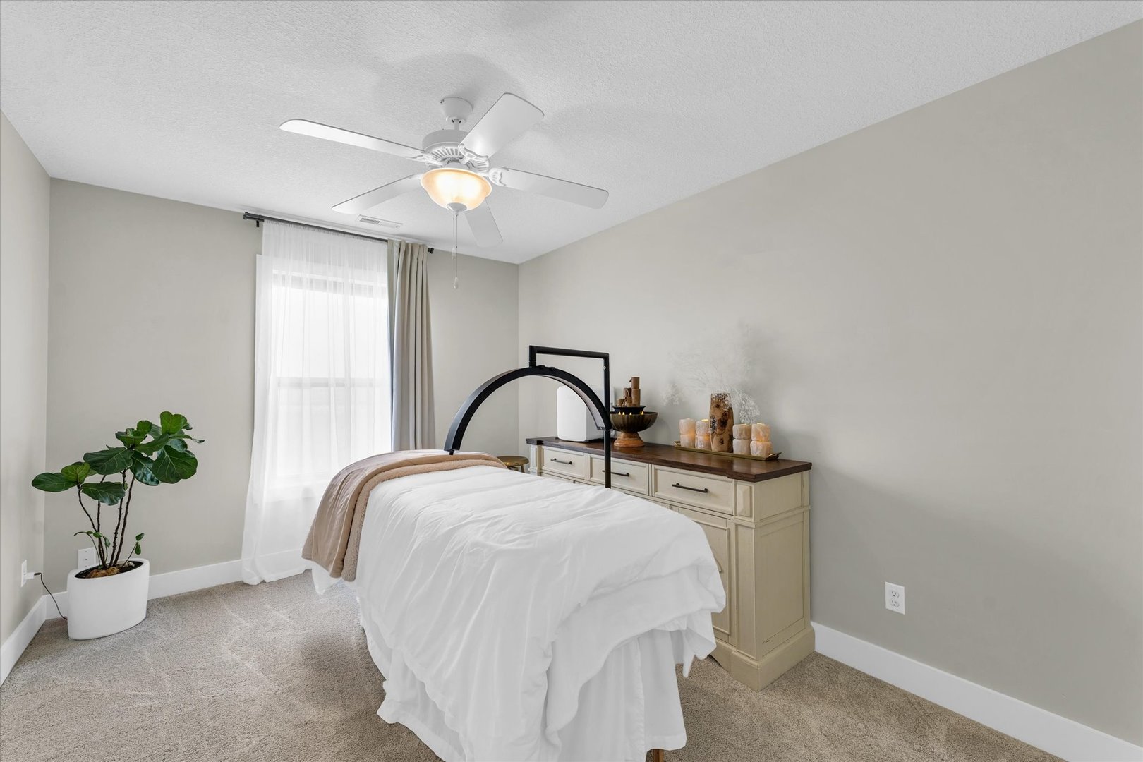 1908 Littlefield Lane Mahomet, IL 61853 - Photo 40 of 51 a bedroom with a bed and a chandelier