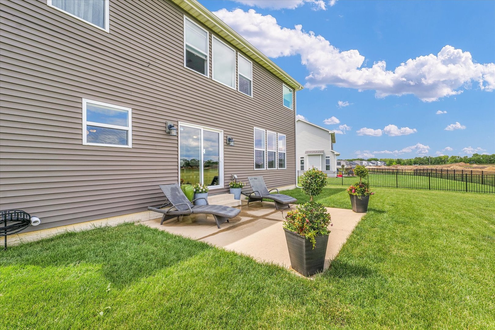 1908 Littlefield Lane Mahomet, IL 61853 - Photo 50 of 51 a view of a backyard with plants and a patio