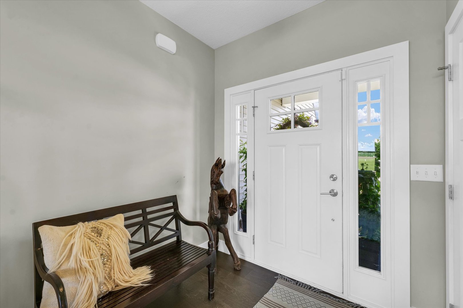 1908 Littlefield Lane Mahomet, IL 61853 - Photo 5 of 51 a view of a hallway with wooden floor and a workspace