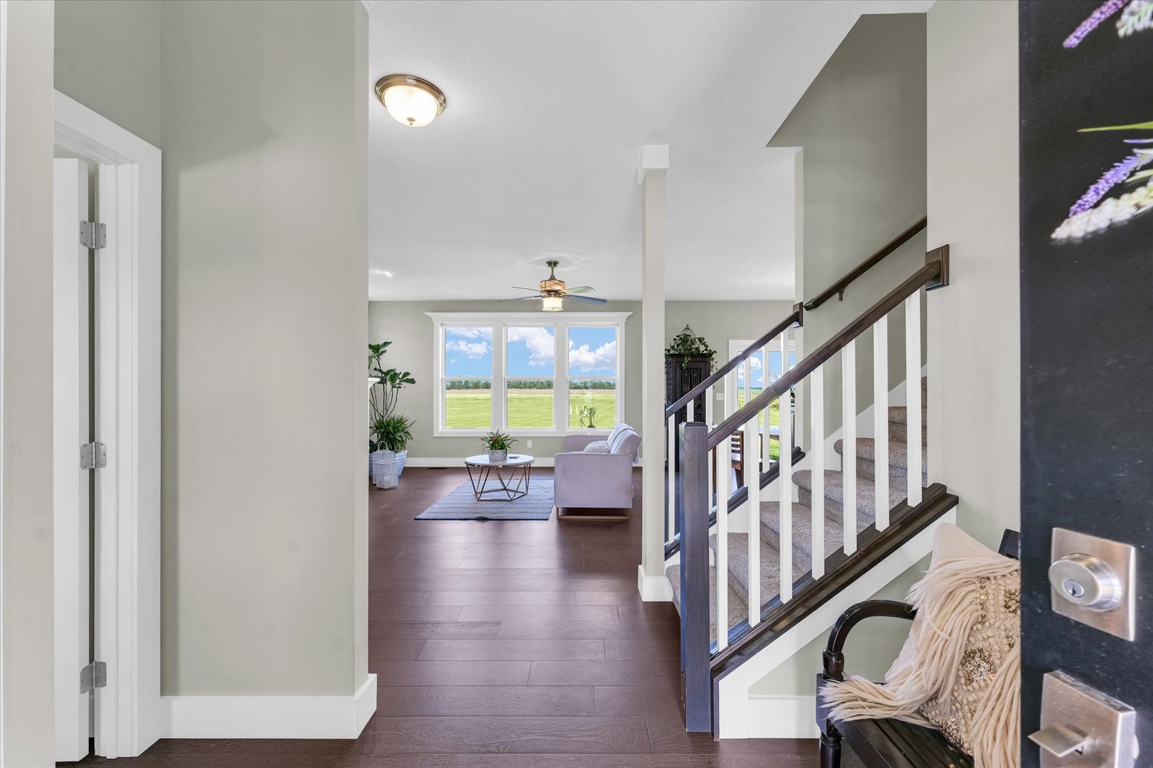 1908 Littlefield Lane Mahomet, IL 61853 - Photo 6 of 51 a view of entryway livingroom and hall with wooden floor