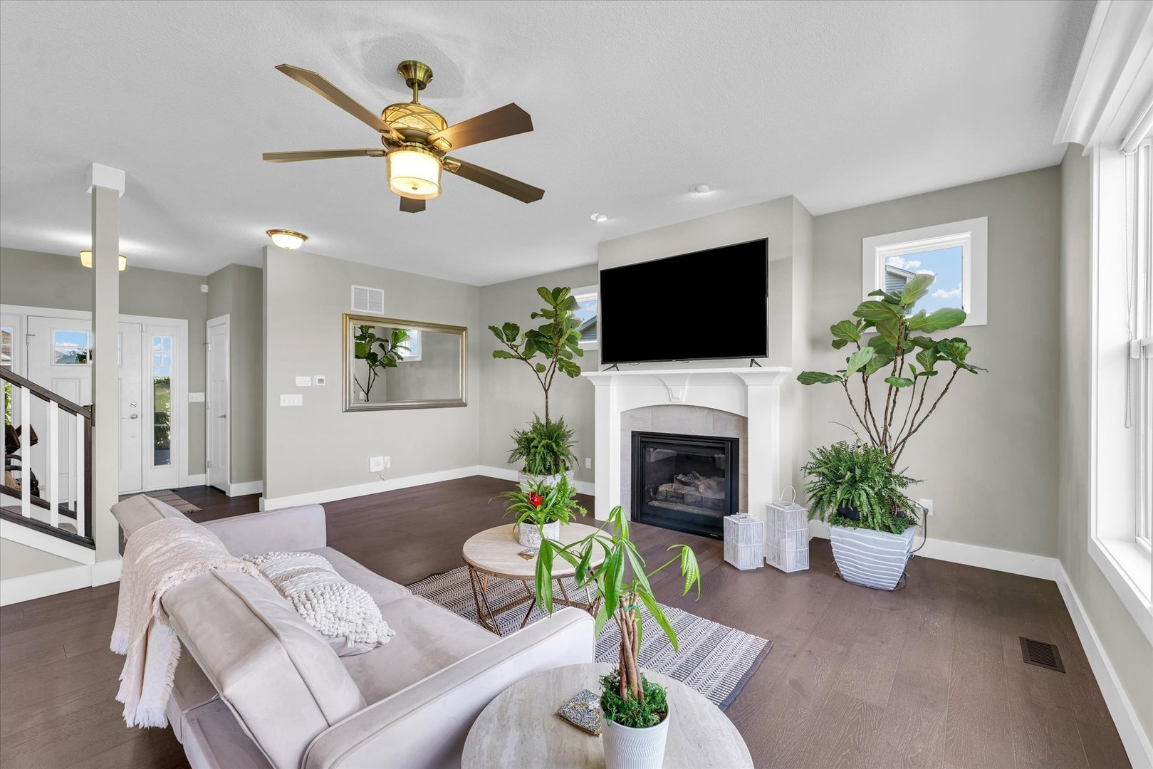 1908 Littlefield Lane Mahomet, IL 61853 - Photo 9 of 51 a living room with furniture a fireplace and a flat screen tv