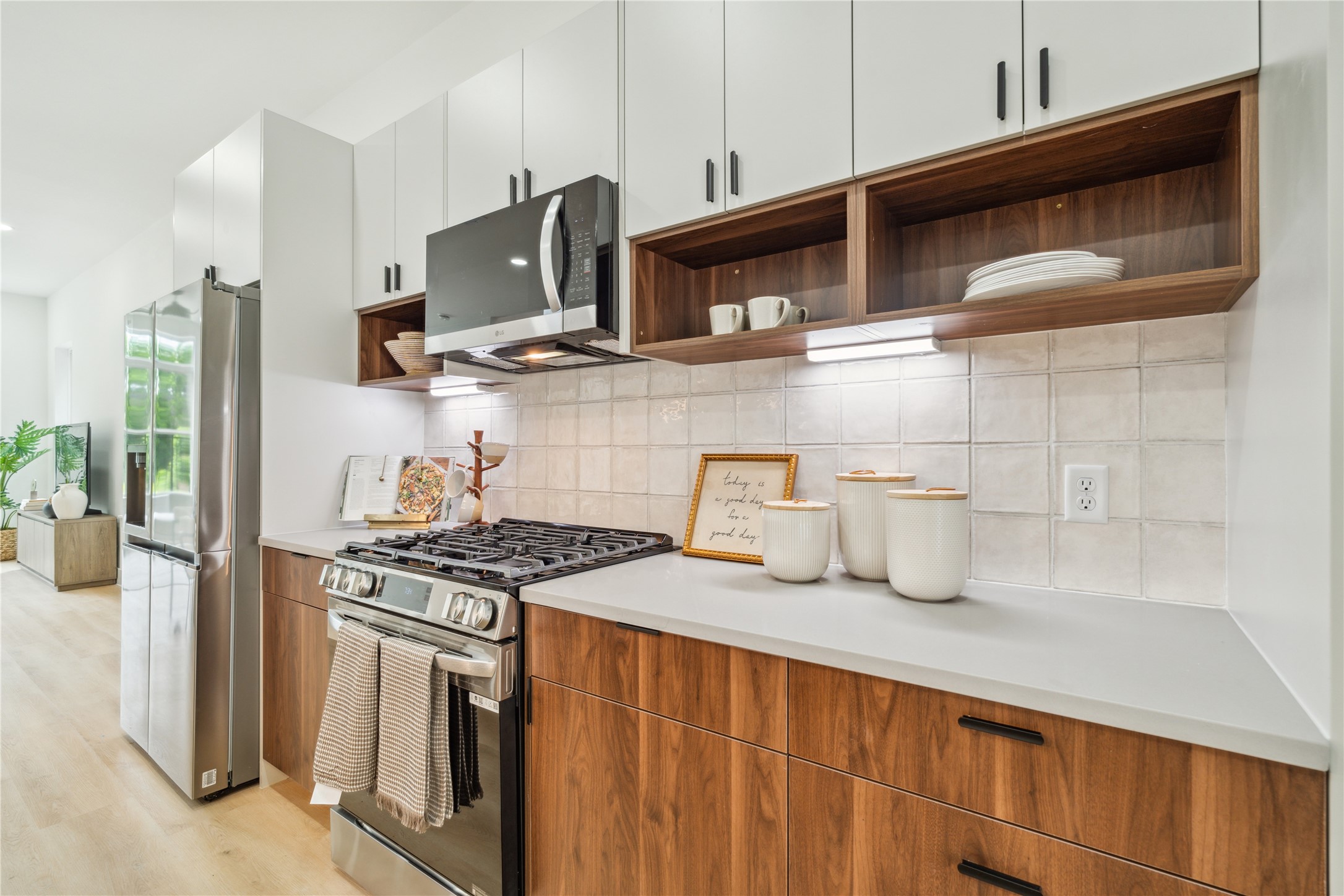 3415 Stonewall Street Houston, TX 77020 - Photo 17 of 50 Dual-purpose cabinetry offers the best of both worlds—open shelving for display-worthy pieces and ample closed storage for everyday essentials.
