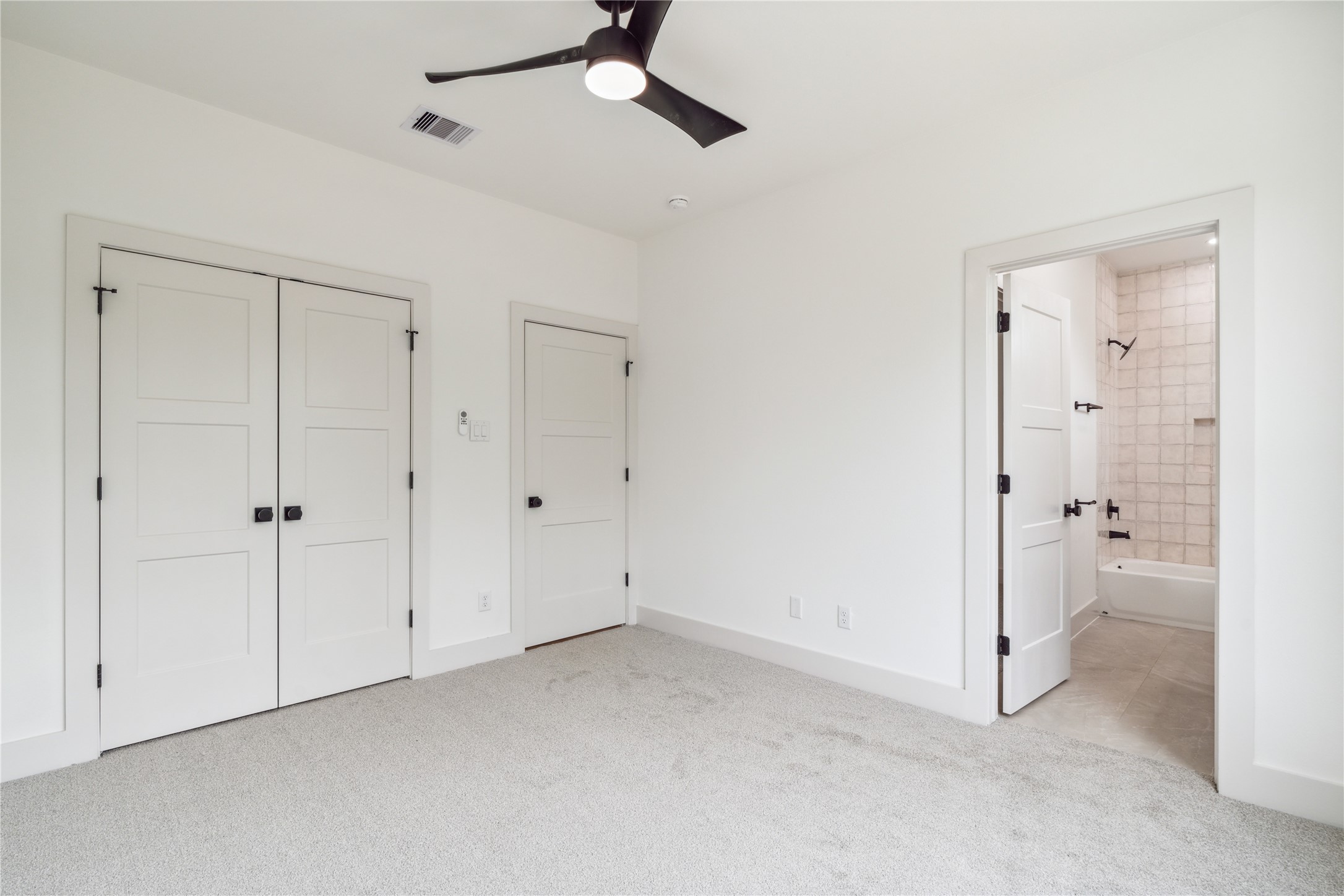 3415 Stonewall Street Houston, TX 77020 - Photo 41 of 50 Complete with its own ensuite bath, this secondary bedroom offers a perfect retreat for guests or family alike.