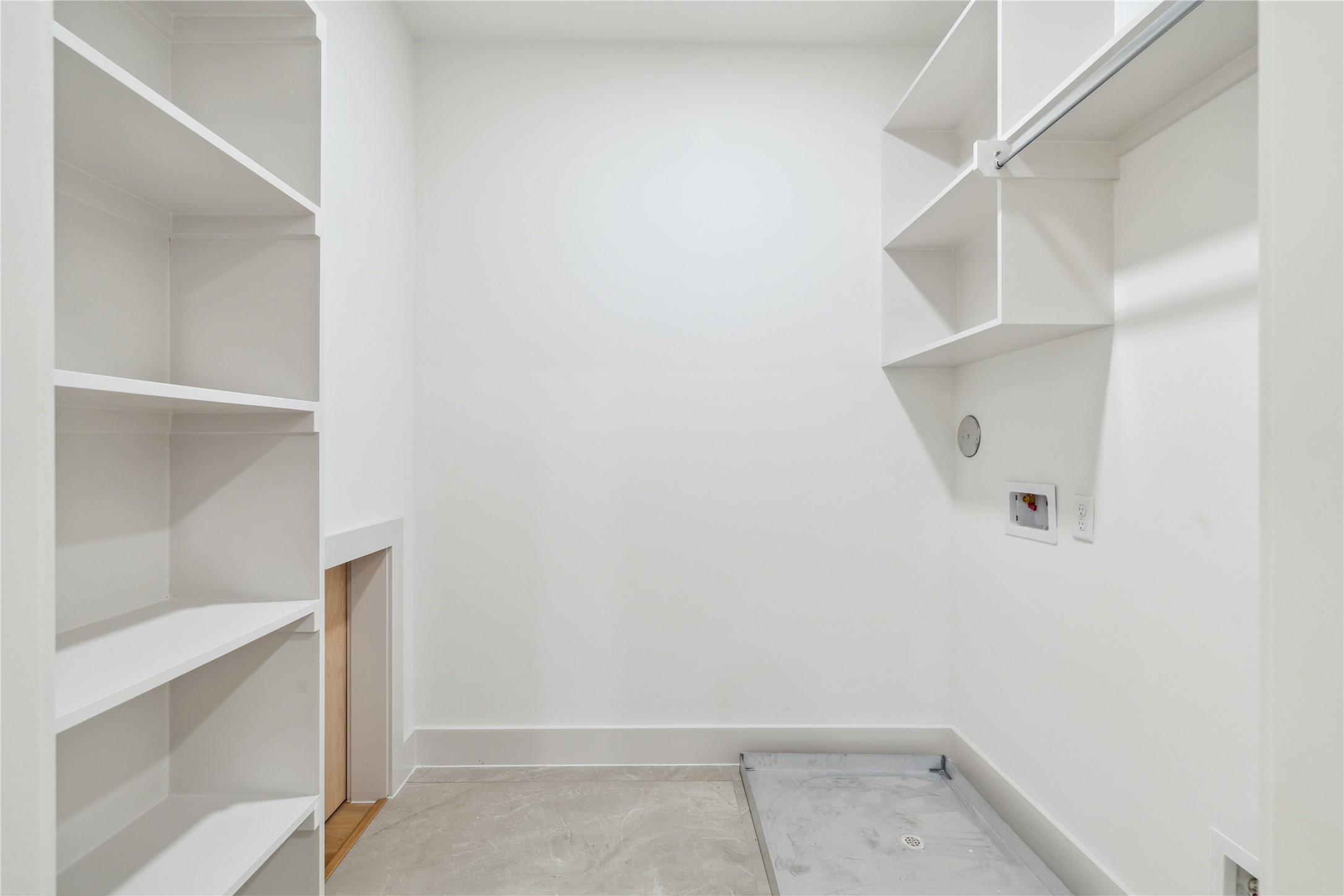 3415 Stonewall Street Houston, TX 77020 - Photo 45 of 50 A dedicated laundry room with custom built-ins and hanging storage makes laundry day feel a little more luxe—and a lot more organized.