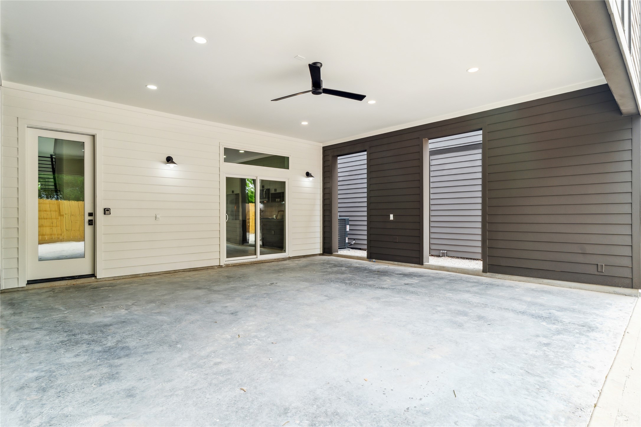 3415 Stonewall Street Houston, TX 77020 - Photo 46 of 50 Enjoy the convenience and protection of oversized covered parking, complete with lighting, ceiling fan, and easy access to the interior of your home.