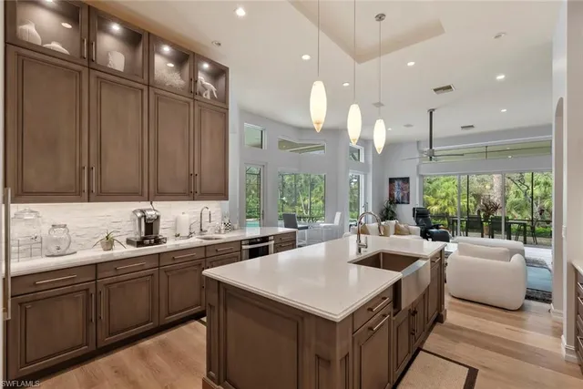 an aerial view of residential houses with outdoor space and river