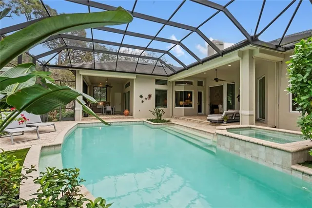 a view of a swimming pool with a patio