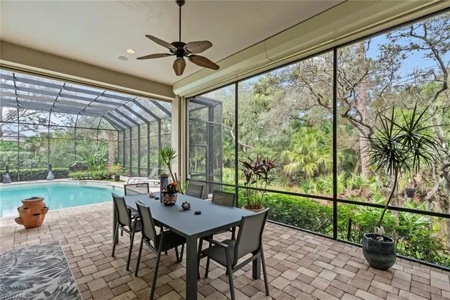 a view of a swimming pool with a patio