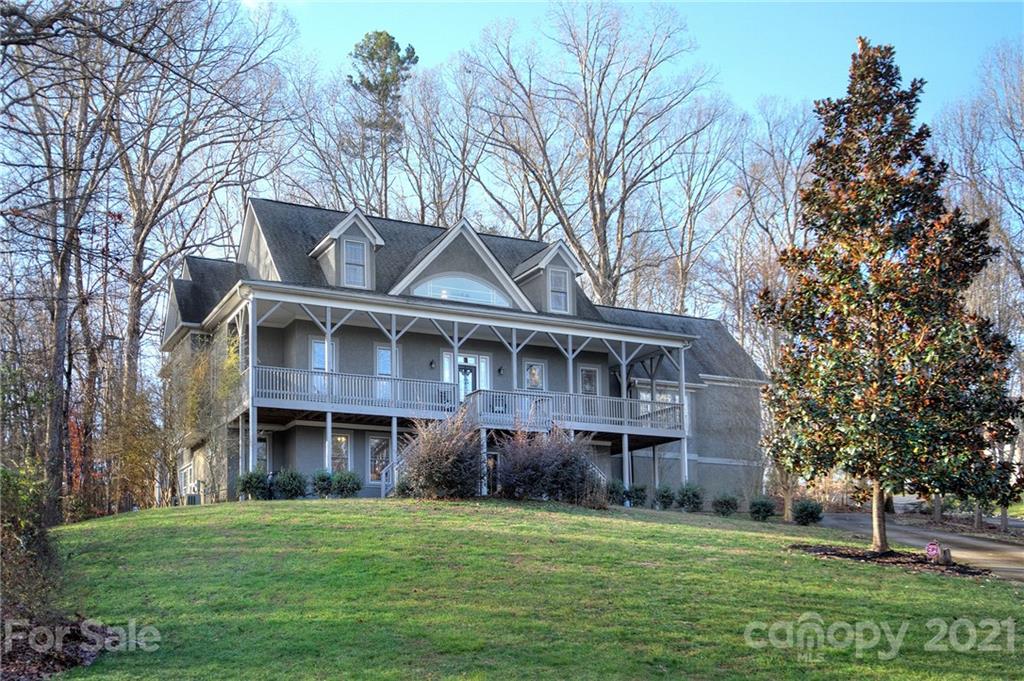 293 Point Carpenter Road Indian Land, SC 29707 - Photo 1 of 46 a front view of a house with a garden