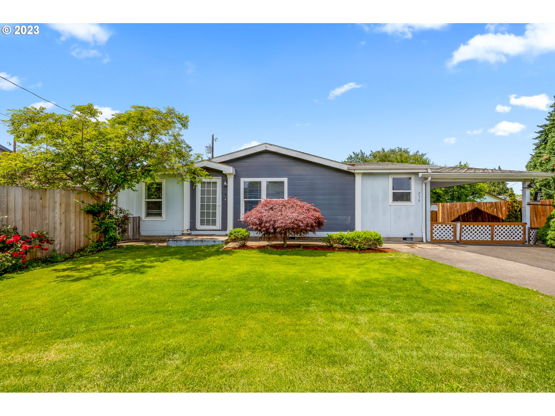 230 19th Street Springfield, OR 97477 - Photo 1 of 34 a front view of house with yard and trees