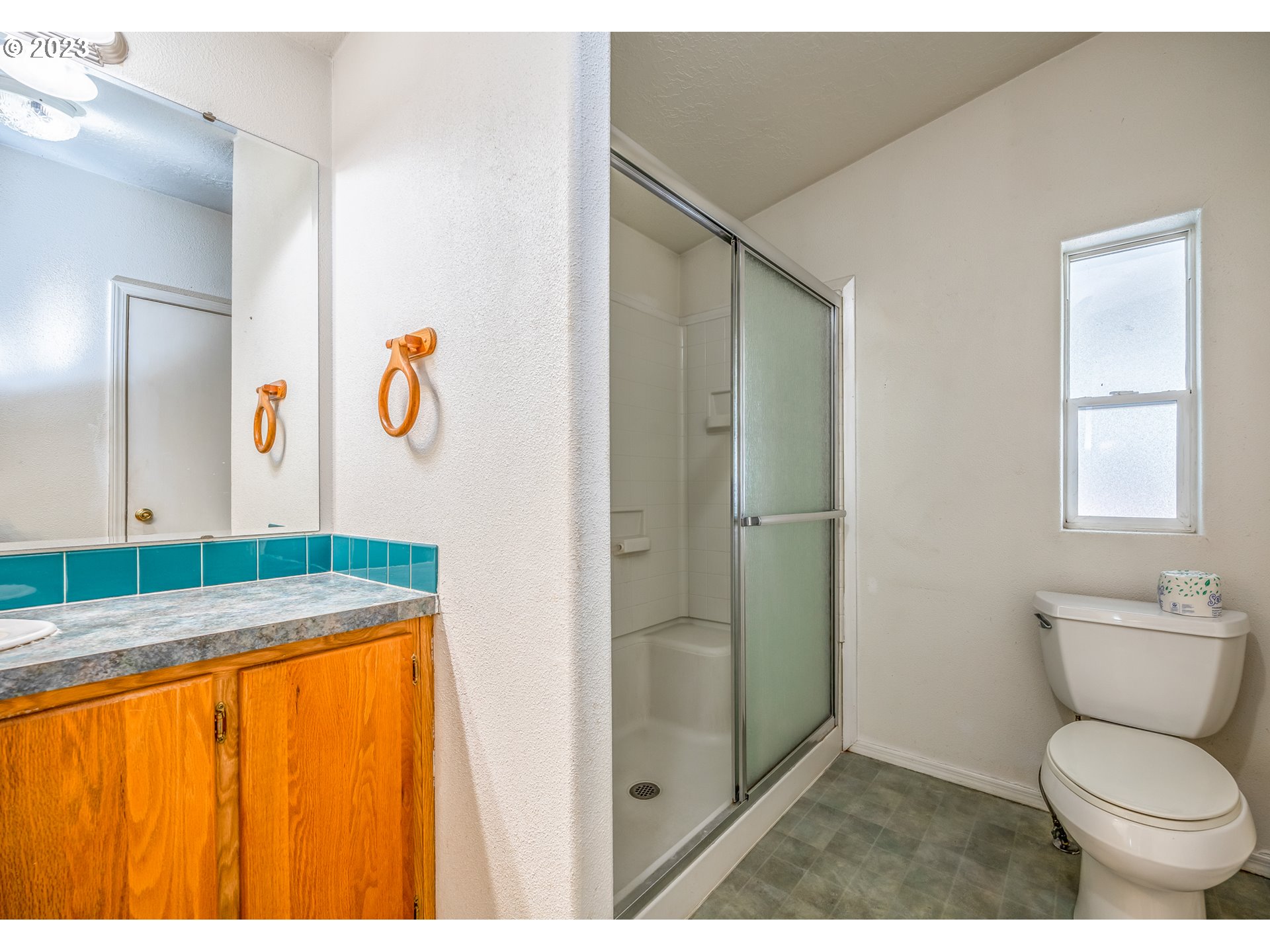 230 19th Street Springfield, OR 97477 - Photo 22 of 34 a bathroom with a sink toilet and shower