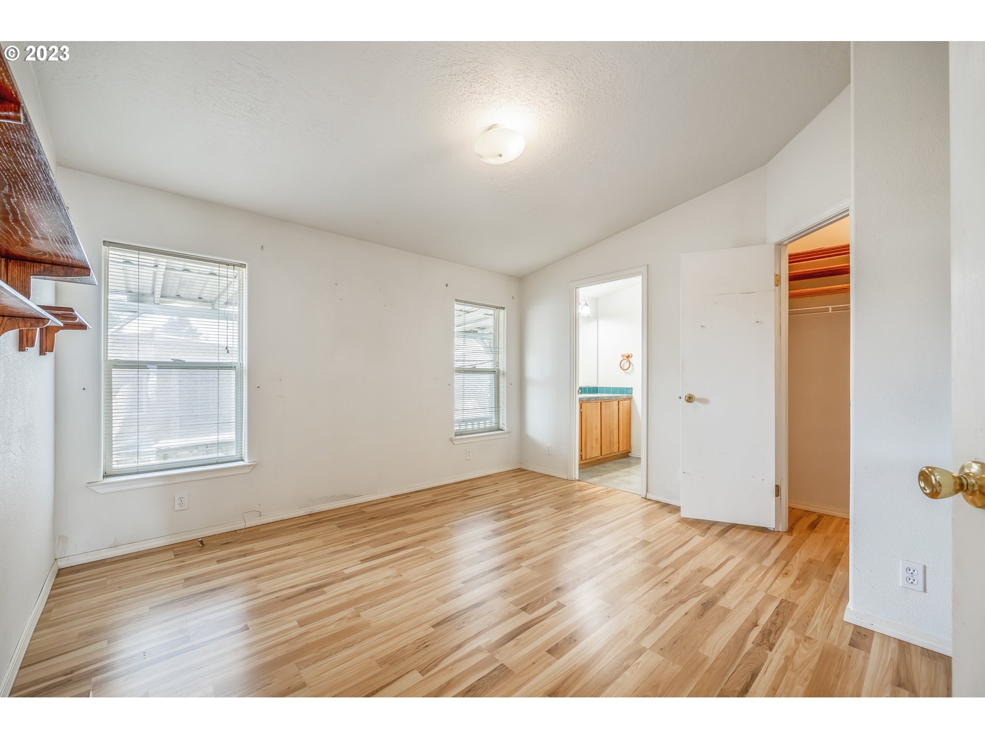 230 19th Street Springfield, OR 97477 - Photo 24 of 34 a view of an empty room with wooden floor and a window