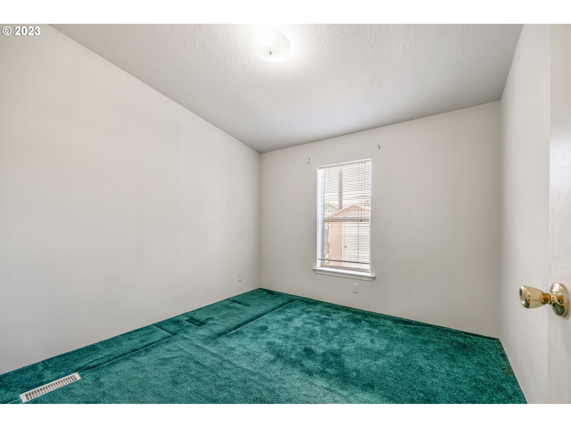 230 19th Street Springfield, OR 97477 - Photo 31 of 34 a view of an empty room with a window