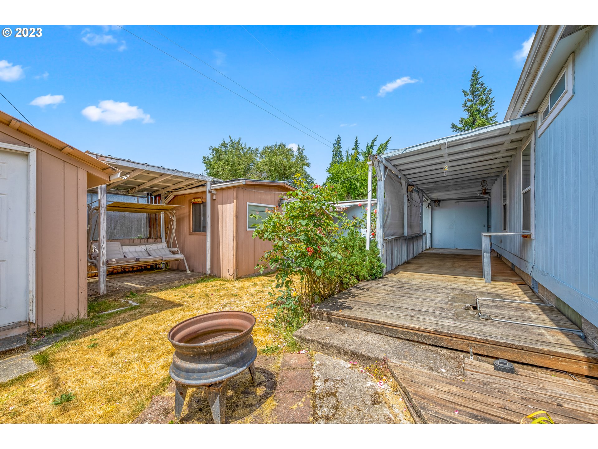 230 19th Street Springfield, OR 97477 - Photo 8 of 34 a view of house with backyard and sitting area