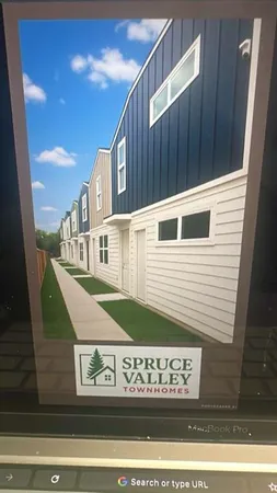 a view of a house with a street