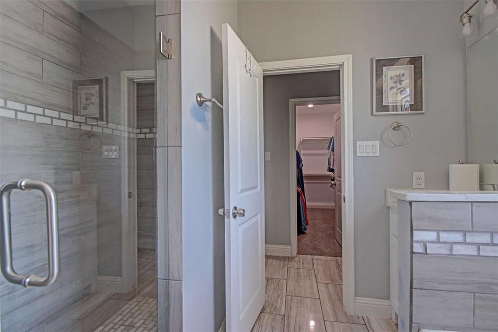 8789 Hutcheson Hill Road Springtown, TX 76082 - Photo 17 of 32 a bathroom with a shower