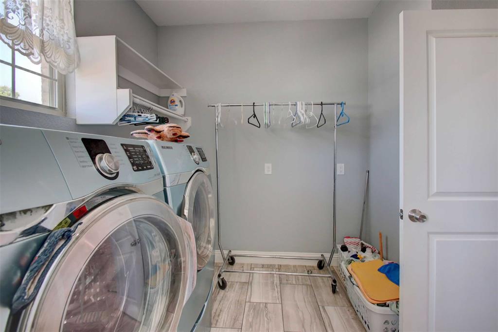 8789 Hutcheson Hill Road Springtown, TX 76082 - Photo 19 of 32 a utility room with dryer and washer