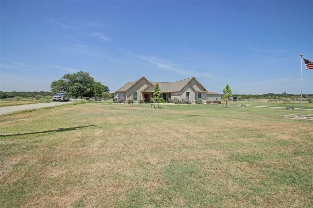 8789 Hutcheson Hill Road Springtown, TX 76082 - Photo 2 of 32 a view of a lake with a houses