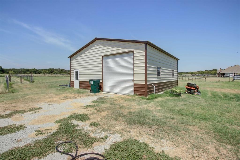 8789 Hutcheson Hill Road Springtown, TX 76082 - Photo 30 of 32 a view of a terrace space