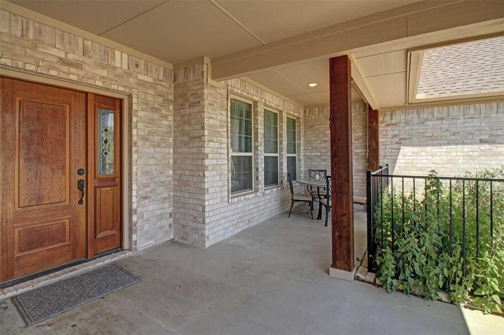 8789 Hutcheson Hill Road Springtown, TX 76082 - Photo 4 of 32 an empty room with windows
