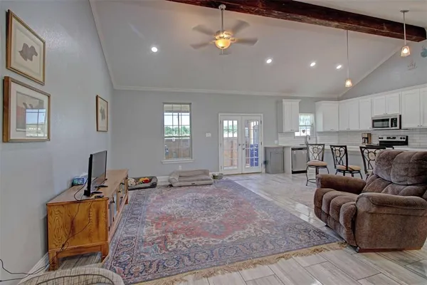 a living room with furniture a couch and chandelier