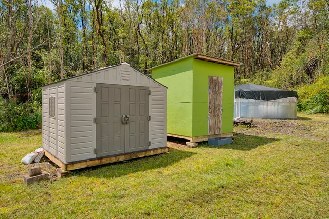 a view of a backyard with a barn