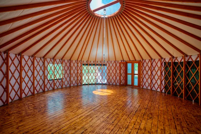a view of a room with wooden floor and staircase