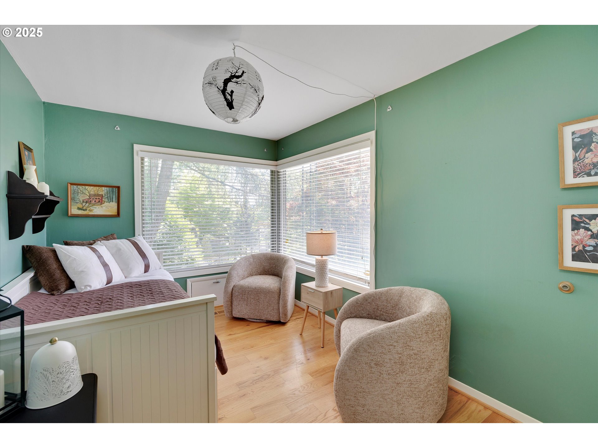 9532 Southwest Boones Ferry Road Portland, OR 97219 - Photo 19 of 45 a bedroom with furniture and a large window