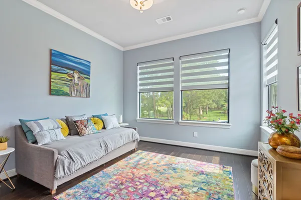 a bedroom with furniture and a window