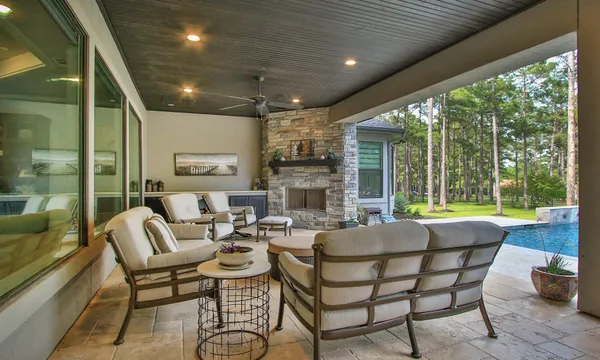 a dining room with furniture wooden floor and a fireplace