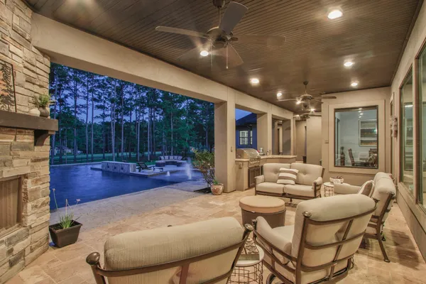a view of a patio with a table and chairs