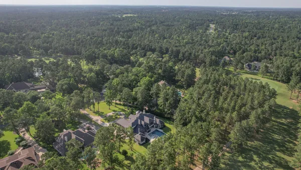 an aerial view of residential house with outdoor space