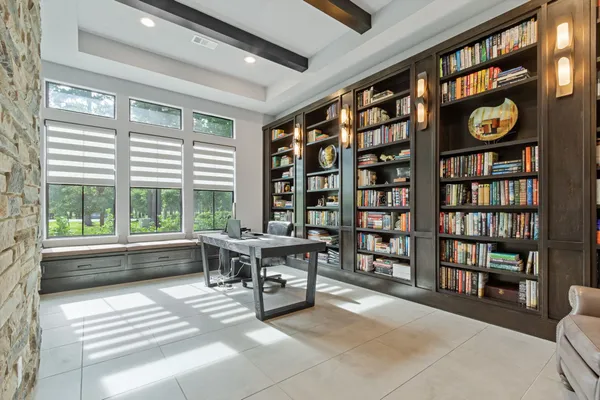 a dining room with furniture and window
