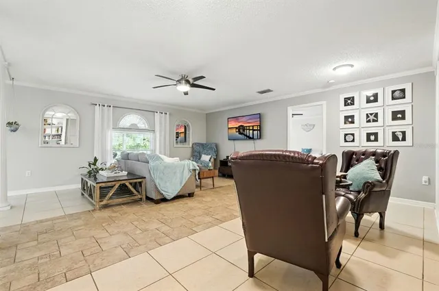 a living room with furniture and a rug