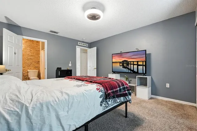 a bathroom with a toilet sink and shower