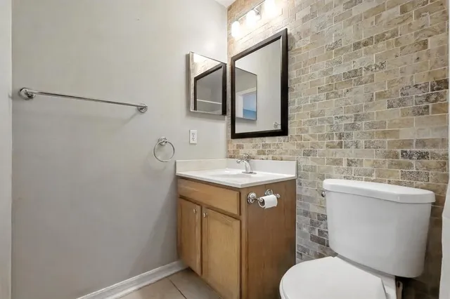 a lobby with furniture and potted plants