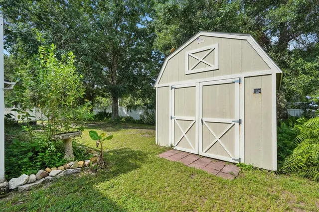 aerial view of a house with a yard