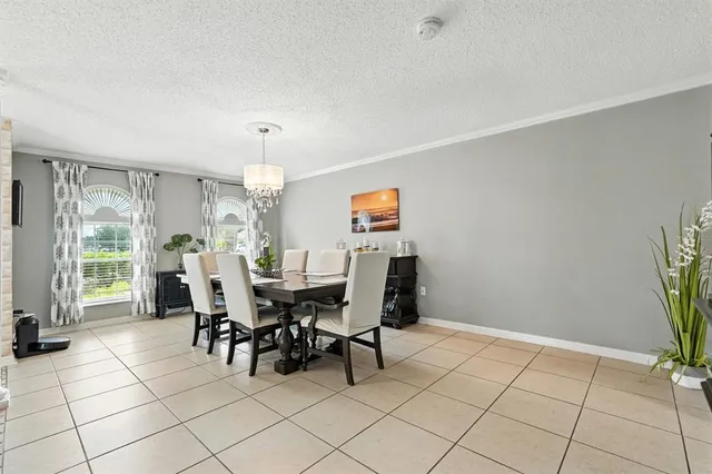 a kitchen with stainless steel appliances granite countertop a stove top oven a sink dishwasher a refrigerator and cabinets with wooden floor