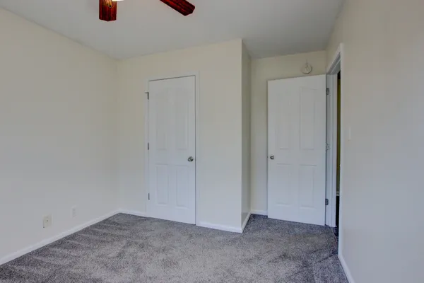 a view of entryway with wooden fence