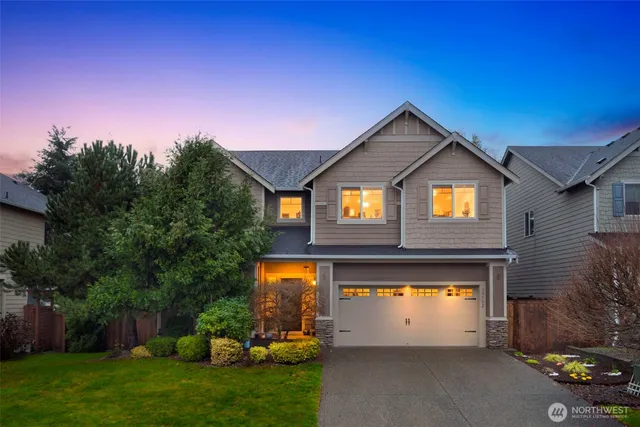 a front view of a house with a yard
