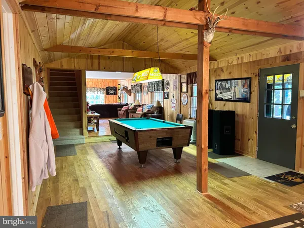 a living room with furniture window and wooden floor