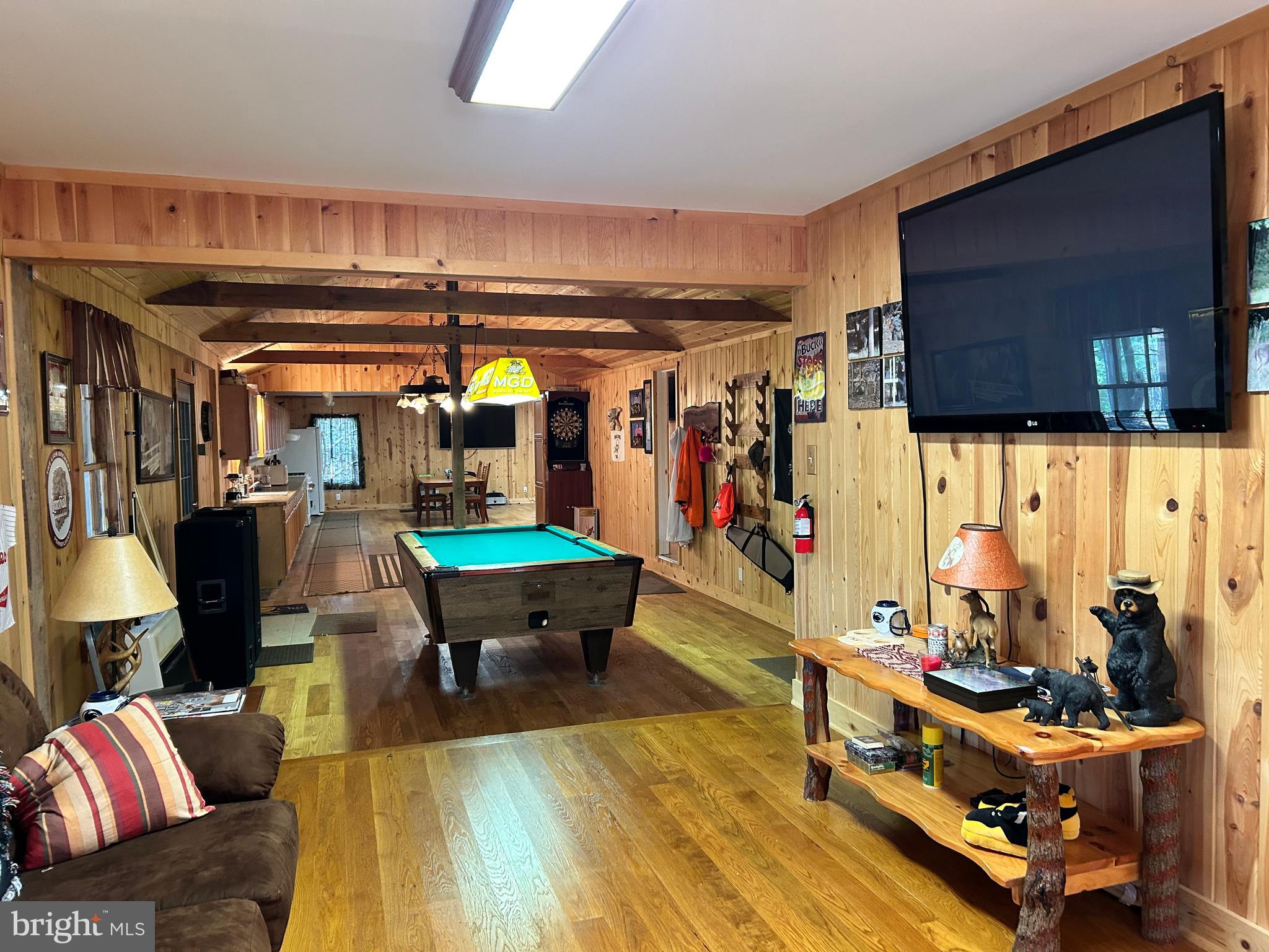 385 Elk Creek Road Aaronsburg, PA 16820 - Photo 18 of 89 a living room with lots of furniture and a flat screen tv