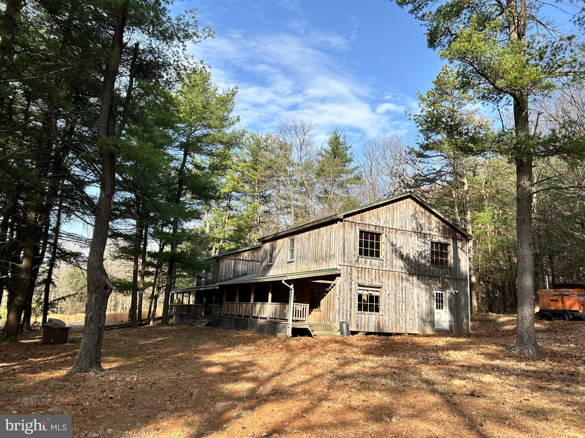 385 Elk Creek Road Aaronsburg, PA 16820 - Photo 2 of 89 a front view of a house with a tree