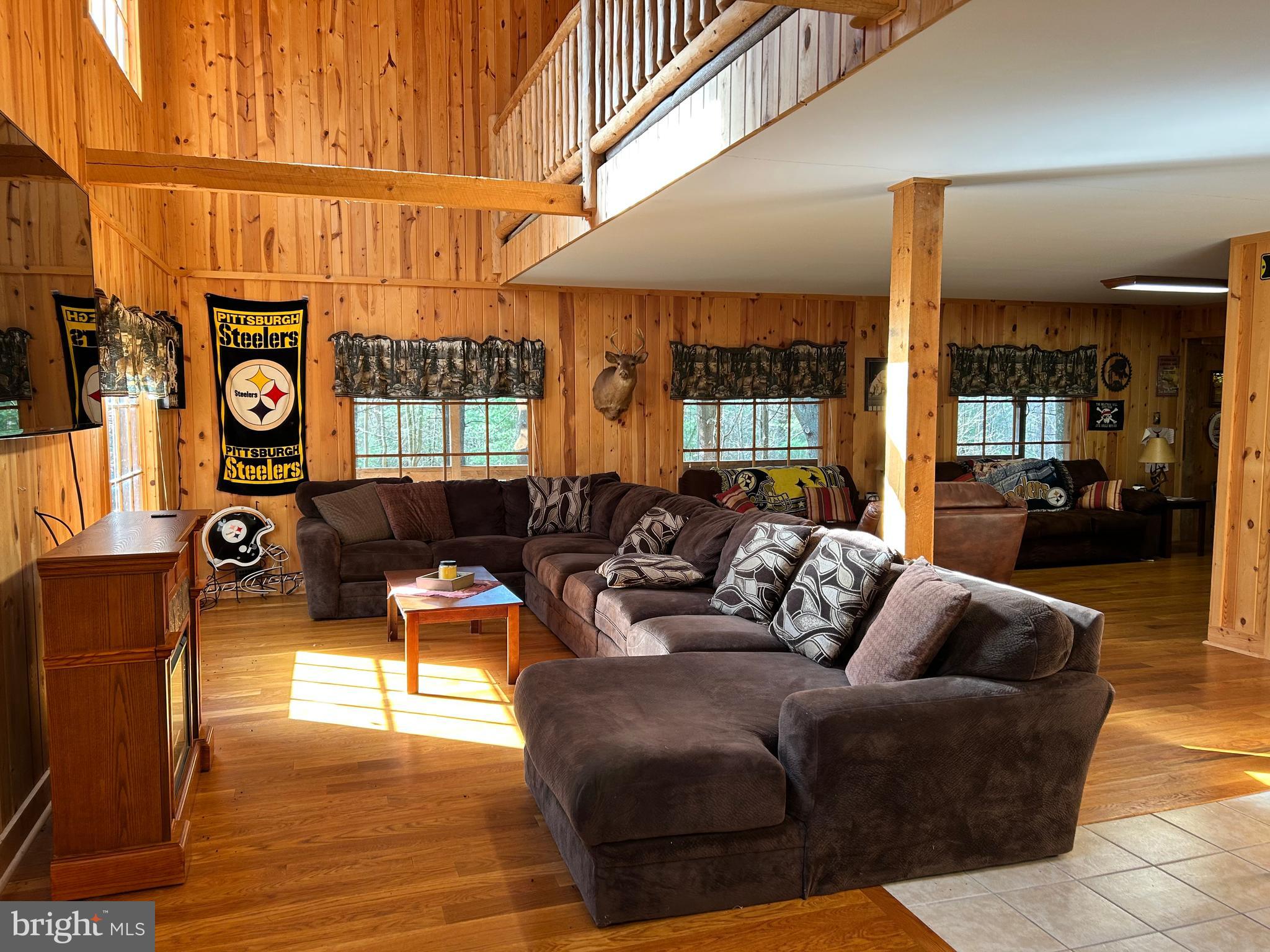 385 Elk Creek Road Aaronsburg, PA 16820 - Photo 27 of 89 a living room with furniture and a window