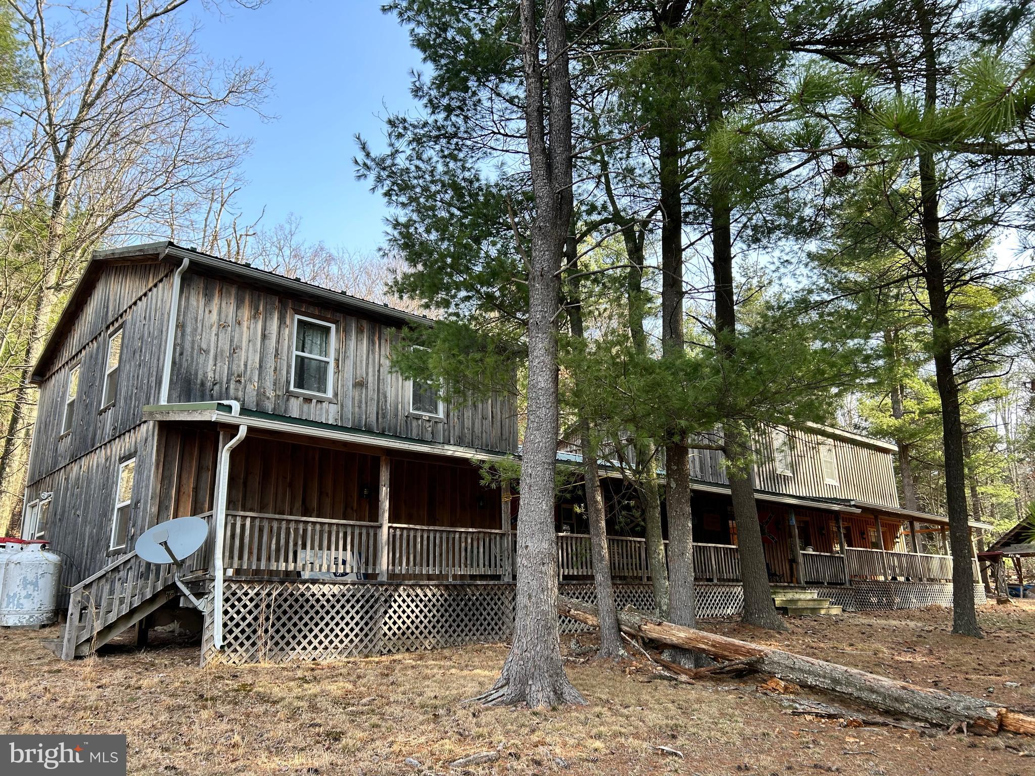 385 Elk Creek Road Aaronsburg, PA 16820 - Photo 3 of 89 a front view of a house with parking yard