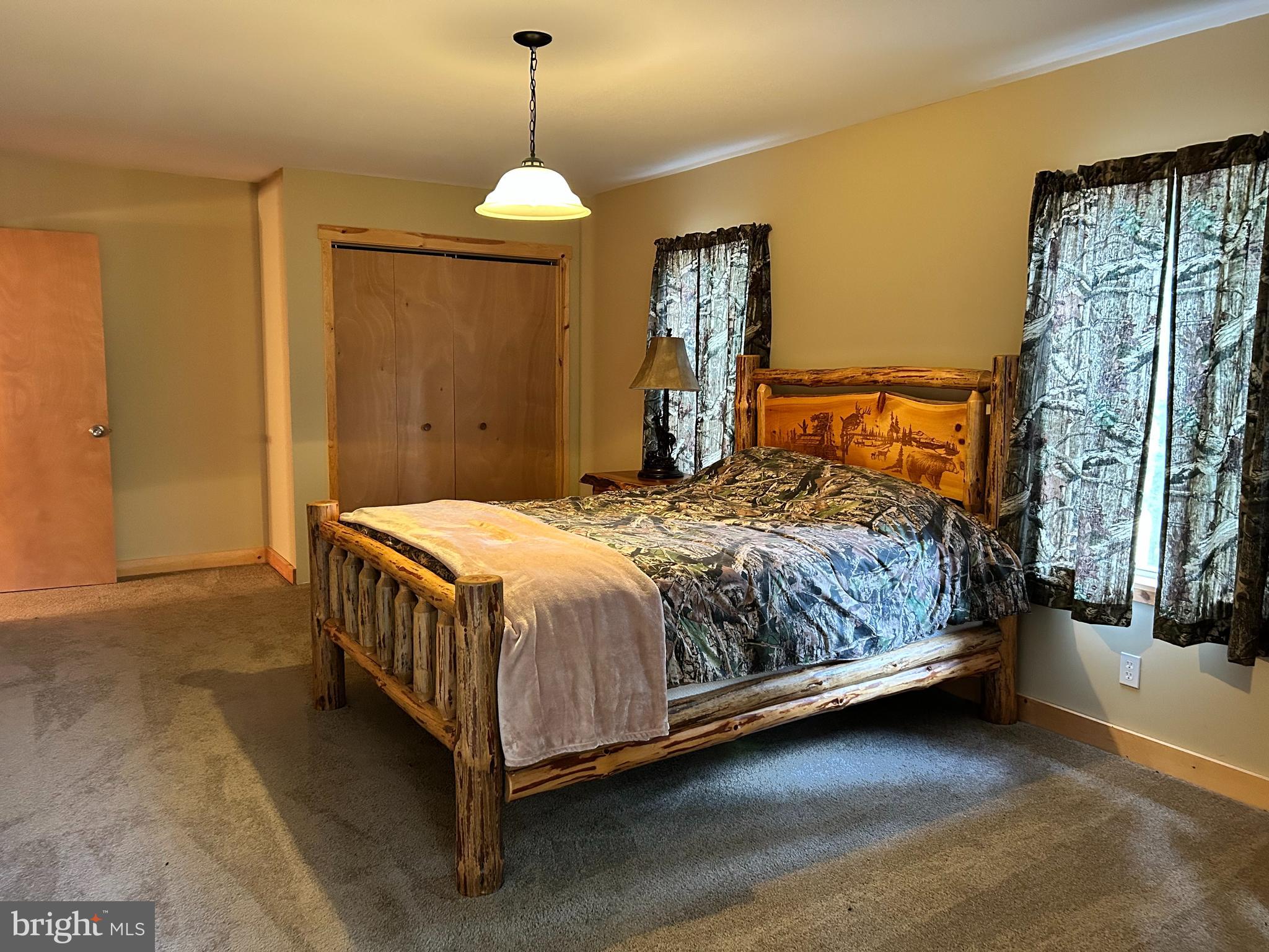 385 Elk Creek Road Aaronsburg, PA 16820 - Photo 40 of 89 a bedroom with a bed and window