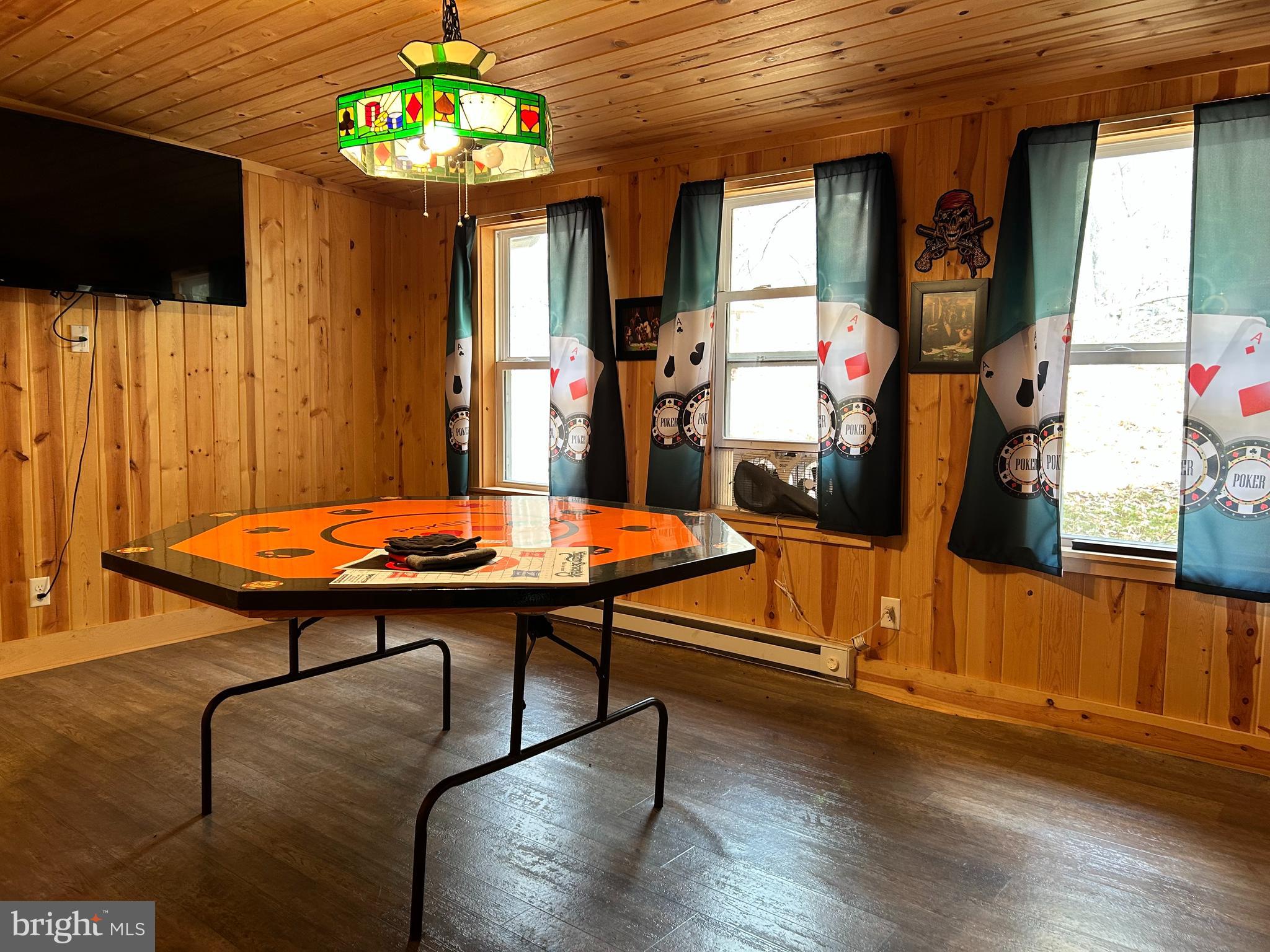 385 Elk Creek Road Aaronsburg, PA 16820 - Photo 4 of 89 a view of a livingroom with furniture window and wooden floor